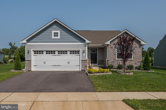 view of front facade with a garage and a front yard