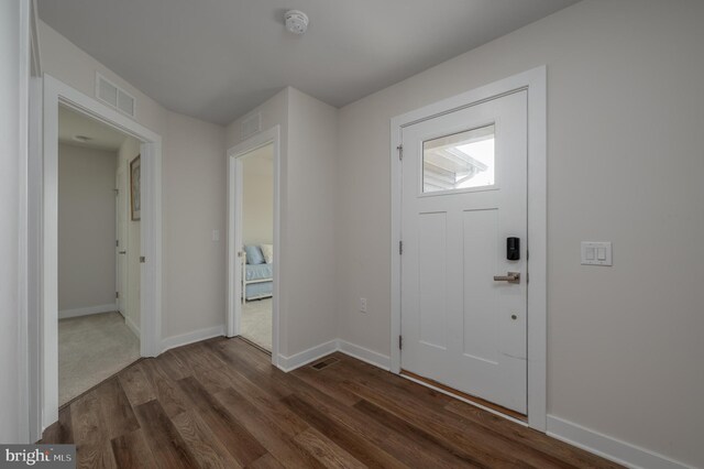 entrance foyer featuring carpet flooring