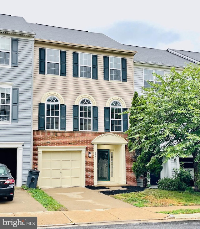 multi unit property featuring a garage