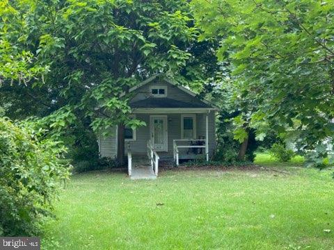 view of outbuilding with a lawn