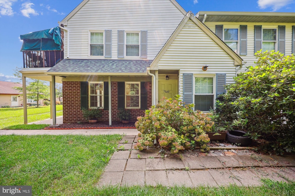 front facade with a front lawn