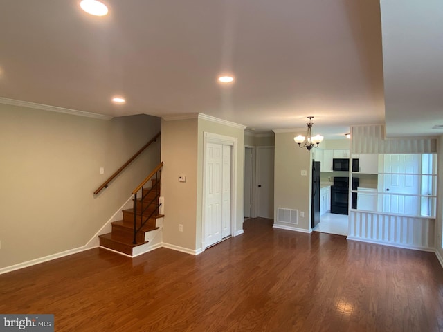 interior space featuring ornamental molding, dark hardwood / wood-style floors, and a chandelier