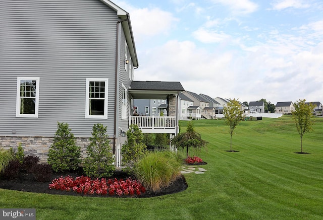 view of yard featuring a balcony