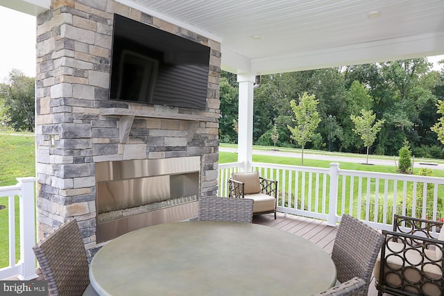 view of patio / terrace featuring an outdoor stone fireplace