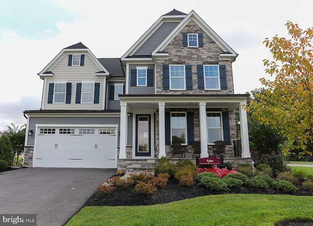 craftsman-style home featuring a garage and covered porch