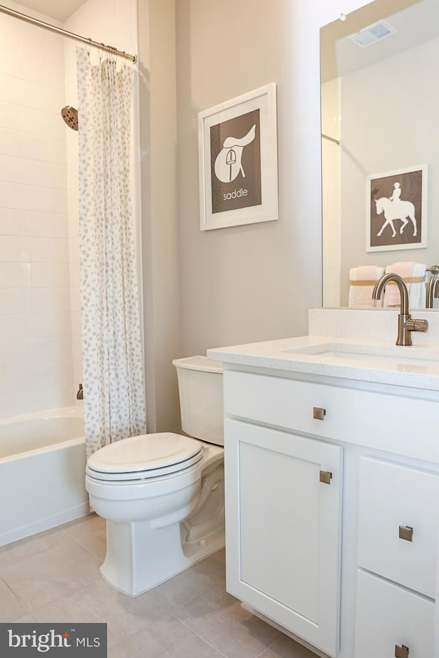 full bathroom with tile patterned flooring, vanity, toilet, and shower / bath combo