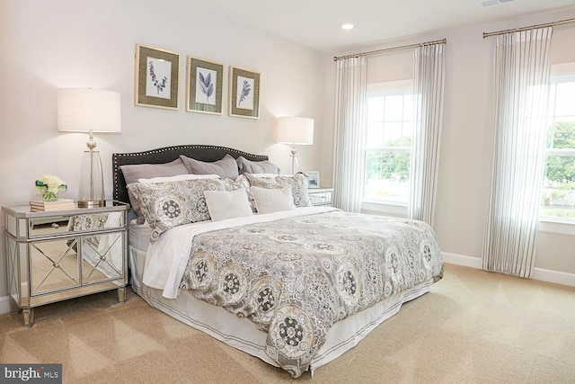 bedroom with light colored carpet