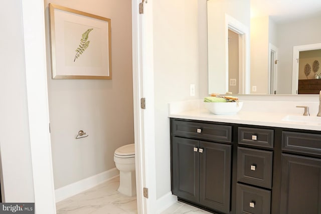 bathroom with vanity and toilet