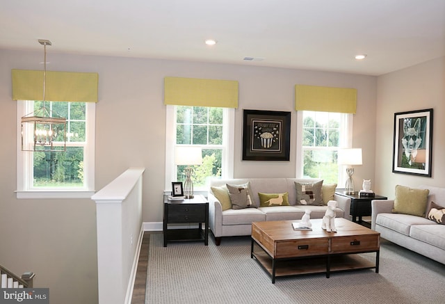 living room with plenty of natural light and hardwood / wood-style floors