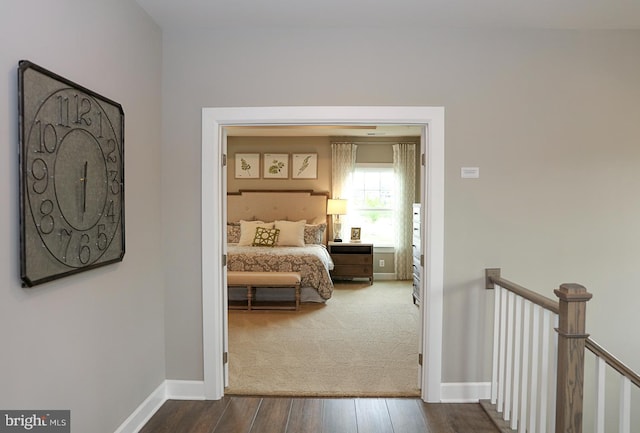 corridor with dark hardwood / wood-style floors