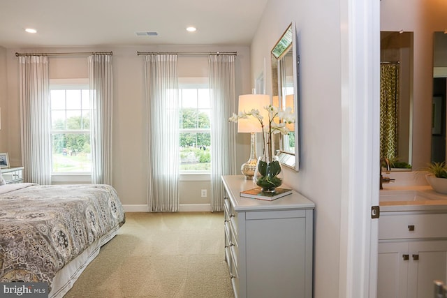 carpeted bedroom featuring sink