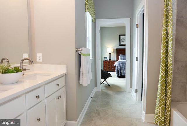 bathroom with shower / bathtub combination with curtain and vanity