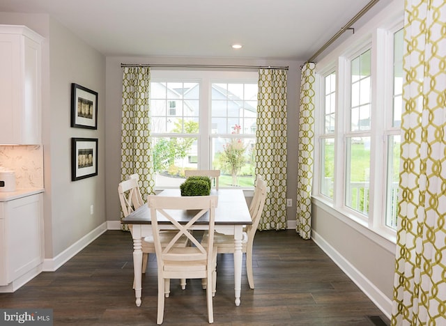 dining area featuring dark hardwood / wood-style flooring