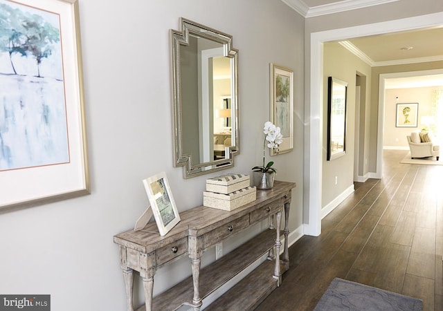 corridor with dark hardwood / wood-style flooring and ornamental molding