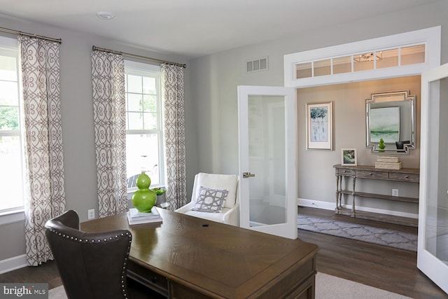 interior space with dark hardwood / wood-style floors and french doors