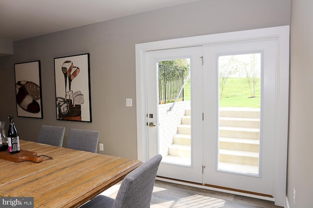 entryway featuring plenty of natural light and light hardwood / wood-style floors