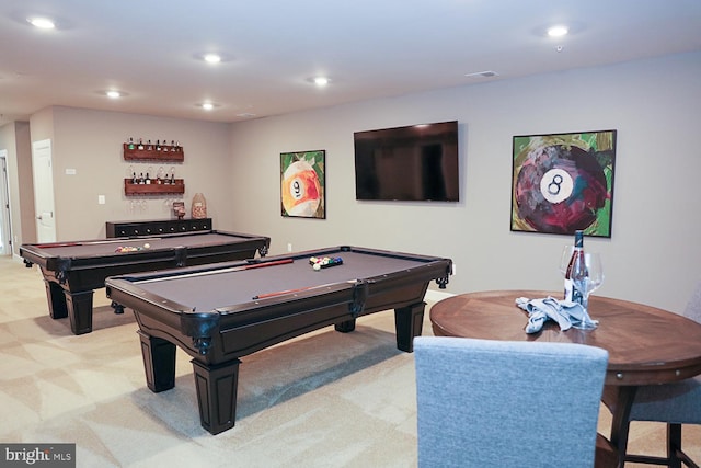 playroom with light carpet, billiards, and bar area