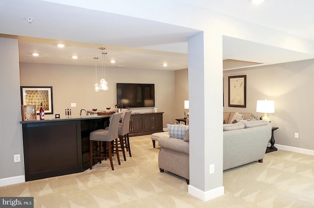 living room with indoor bar and light colored carpet