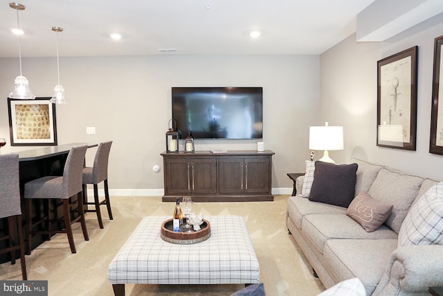 living room featuring light carpet