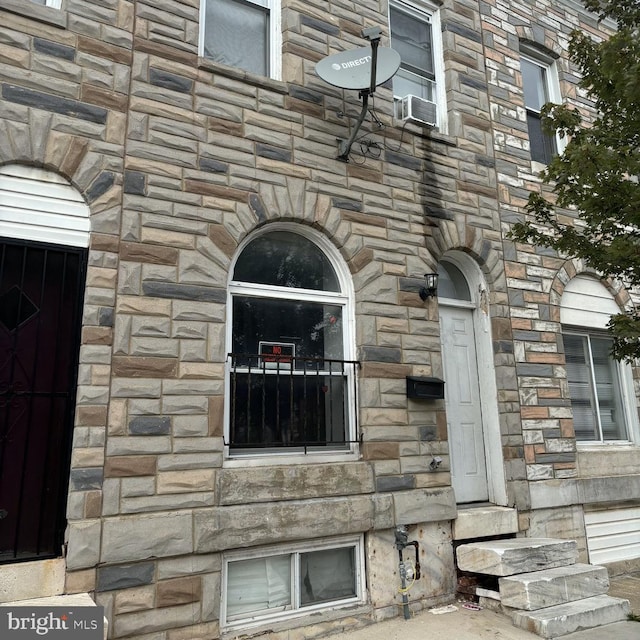 exterior space with stone siding