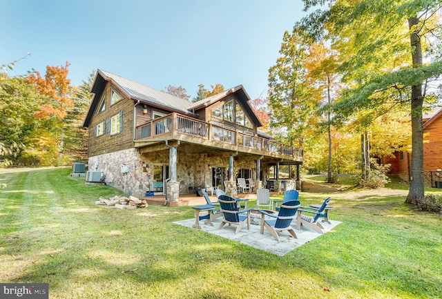 back of property featuring central AC, a patio, and a yard