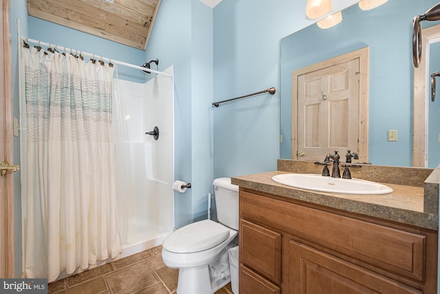 bathroom featuring toilet, a shower with curtain, tile patterned floors, vanity, and vaulted ceiling