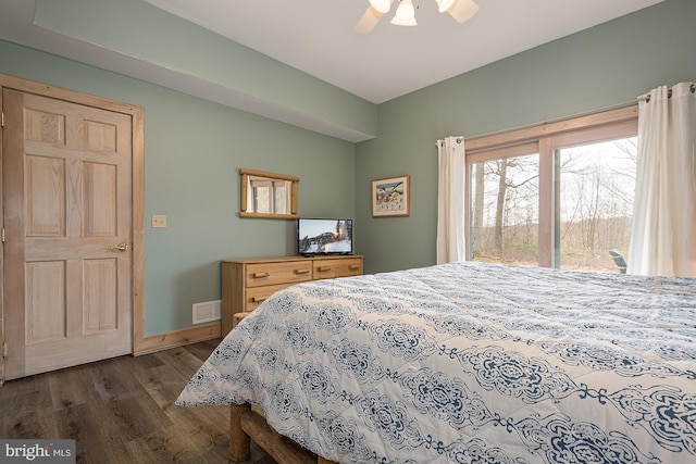 bedroom featuring ceiling fan and dark hardwood / wood-style flooring