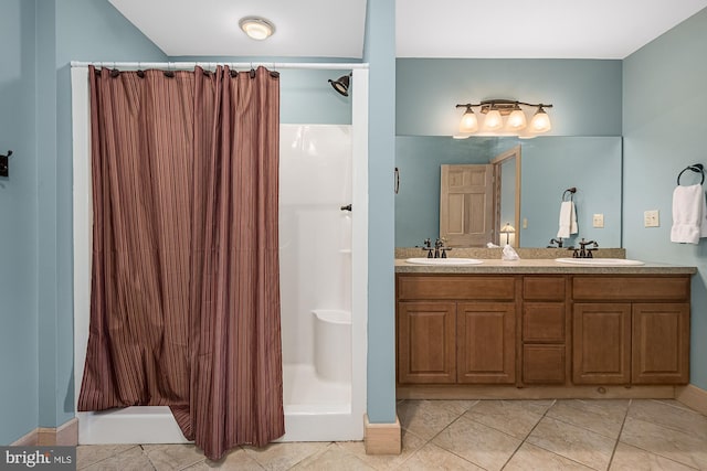 bathroom with double sink vanity, tile patterned floors, and a shower with shower curtain