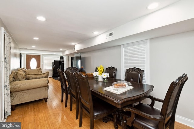 dining space featuring light wood-type flooring