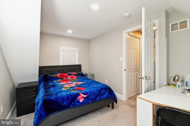 bedroom featuring light carpet