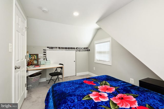 carpeted bedroom featuring vaulted ceiling