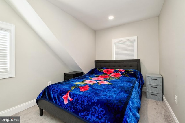 bedroom featuring light colored carpet