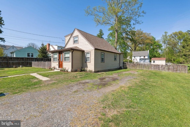 view of side of home featuring a lawn