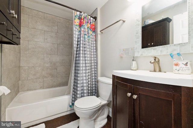 full bathroom with vanity, shower / bath combination with curtain, and toilet