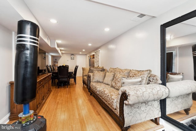 living room with light hardwood / wood-style floors