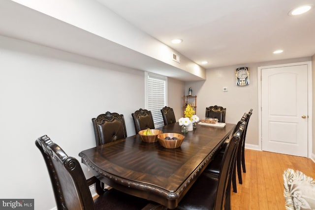 dining space featuring light wood-type flooring