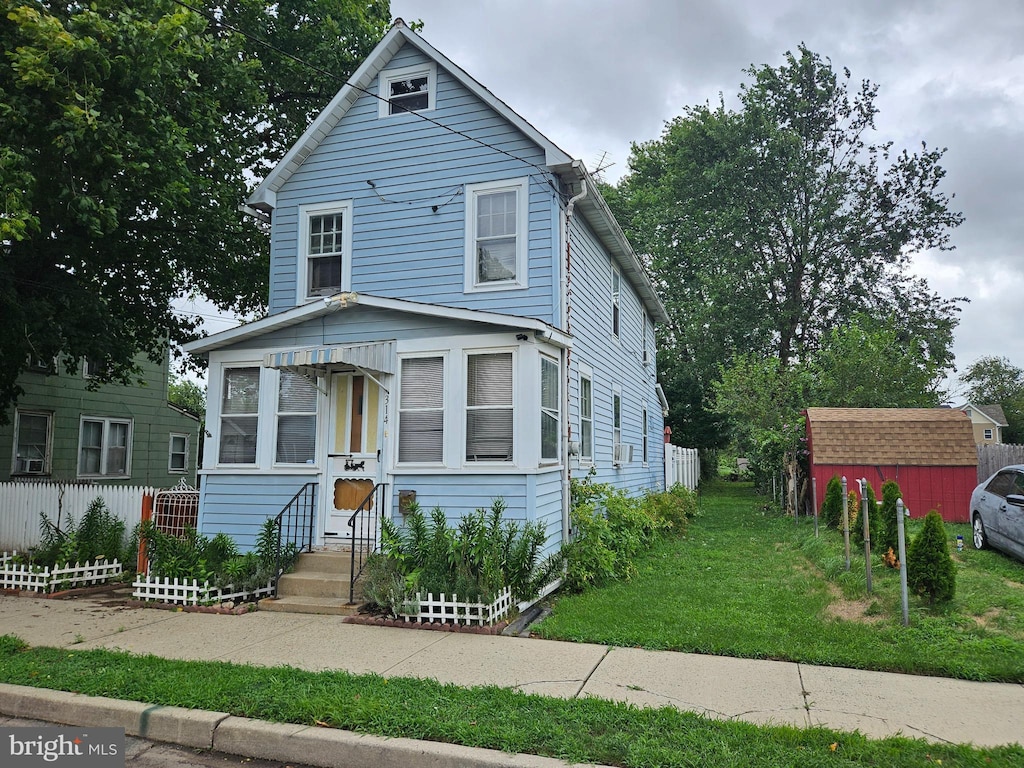 view of front property with a front lawn