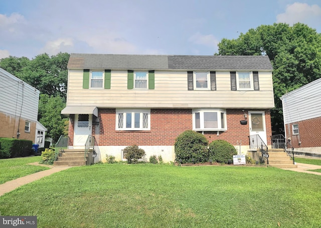 view of front of home with a front yard