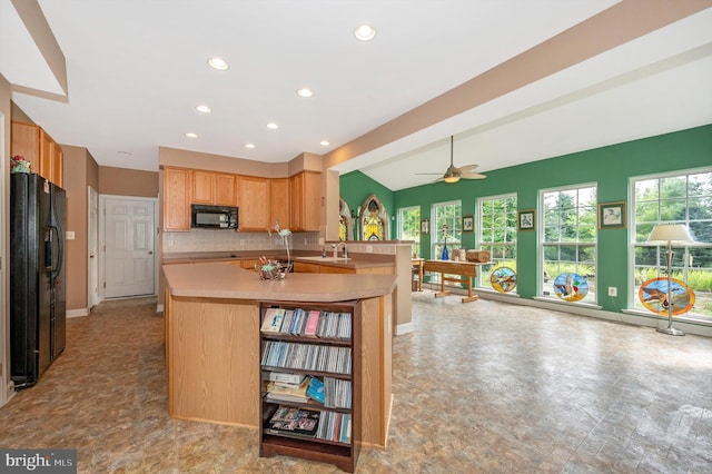 kitchen with black appliances, kitchen peninsula, decorative backsplash, ceiling fan, and vaulted ceiling with beams