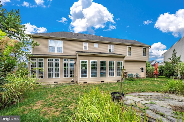 back of house featuring a yard and a patio area