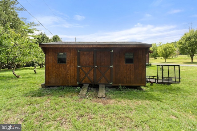 view of outdoor structure with a yard