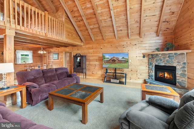 living room featuring a fireplace, carpet floors, wooden walls, and wood ceiling