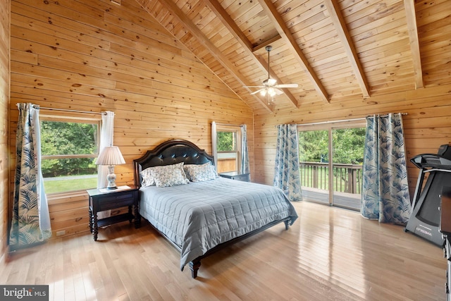 bedroom with light hardwood / wood-style flooring, wooden ceiling, wooden walls, access to exterior, and beamed ceiling