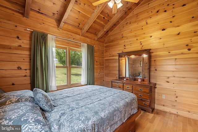 bedroom featuring wood ceiling, ceiling fan, wood walls, light hardwood / wood-style flooring, and vaulted ceiling with beams