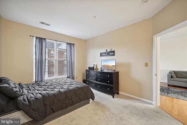 bedroom with light wood-type flooring