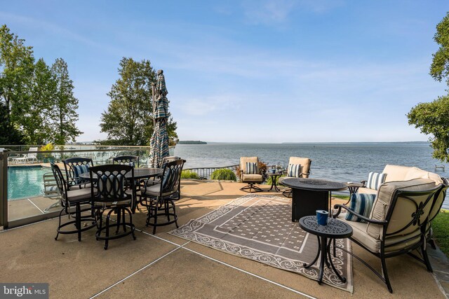 view of patio with a water view