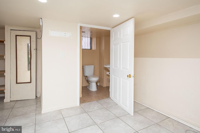 bathroom with tile patterned floors and toilet