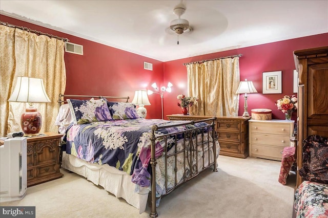 carpeted bedroom with ceiling fan and crown molding