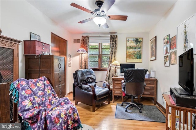 office area with ceiling fan and light hardwood / wood-style flooring