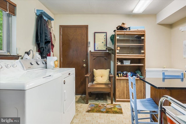 washroom featuring laundry area and washer and clothes dryer